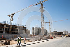 Building site with cranes and blue sky