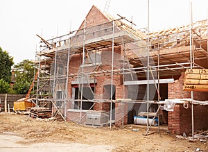 Building Site With House Under Construction