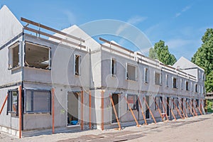 Building site with rows of houses under construction