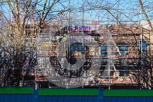 Building site with scaffolding, photographed in north west London on a sunny winter`s day.