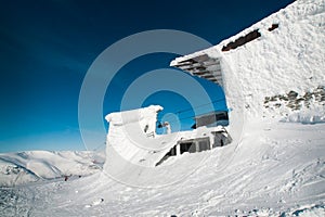 The building of the ski lift in the snow