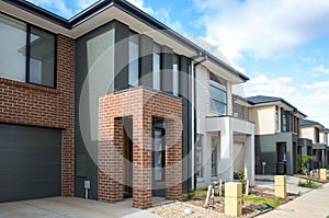 Building of some residential townhouses in a suburb of Australia. The exteriors of some two-story modern Australian suburban homes