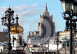 Building of Stalinist style and bell tower of church in Moscow