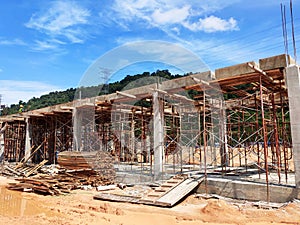 The building structure is made of reinforced concrete still under construction.