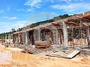 The building structure is made of reinforced concrete still under construction.