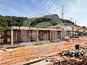 The building structure is made of reinforced concrete still under construction.