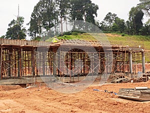 The building structure is made of reinforced concrete still under construction.