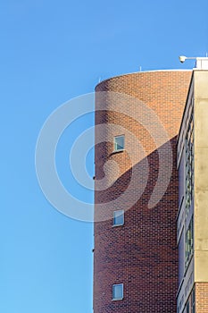 Building with surveillance camera against blue sky