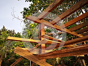 Building a tiny wooden house on the beach side.