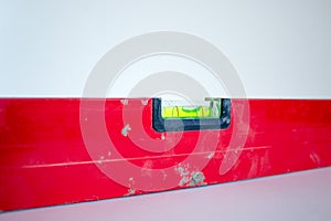 Building tool level. Red water level tool isolated on white background. Concept. Copy space