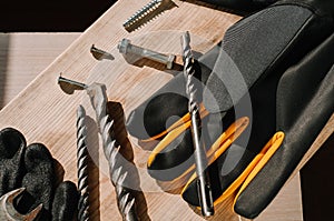 Building tools including centimeter ruler, wrench and cutter placed in the right side on wooden surface with open space. photo