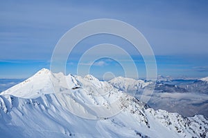 Building on the top of mountains covered with snow in sochi Rosa Khutor ski resort photo