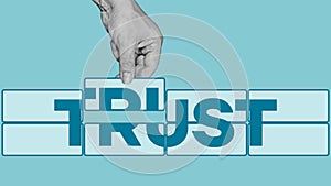 Building trust in business concept. Building a structure of blocks with the word trust