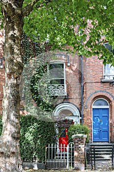 The building is typical Dublin style.