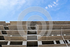 Building under construction against the blue sky