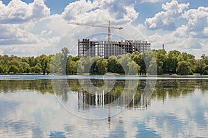 Building under construction on the bank of big lake