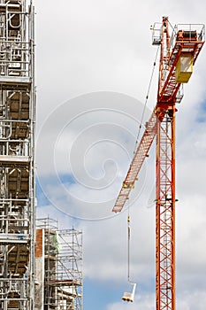 Building under construction. Crane machinery structure. Industry