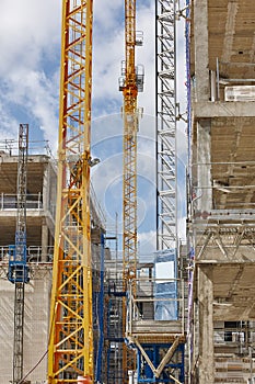 Building under construction. Crane machinery structure. Industry