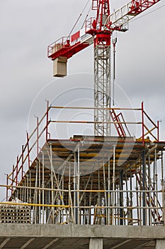 Building under construction. Crane machinery structure. Industry