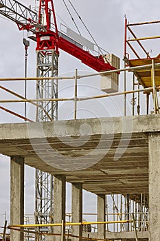 Building under construction. Crane machinery structure. Industry