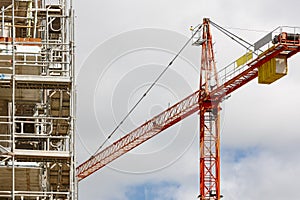 Building under construction. Crane machinery structure. Industry