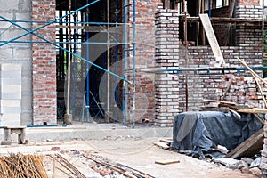 Building under construction, industrial background. Construction site with scaffolding