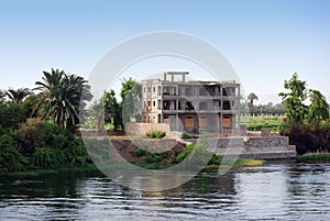 Building under construction on the Nile river shore. Southern Egypt, Africa. Cruising on Nile River