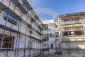 Building under construction with scaffolds