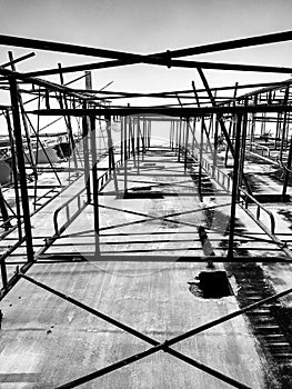 Building under construction. Steel bar or steel reinforcement bar in construction site. Construction crane.Black and White and