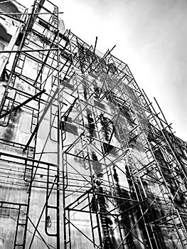 Building under construction. Steel bar or steel reinforcement bar in construction site. Construction crane.Black and White and