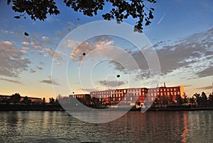 Building under sunset in front of a lake