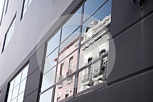 Building wall with reflected window glass