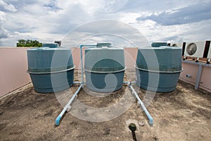 Building water storage tank on blue sky background