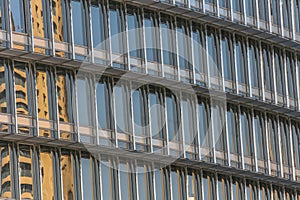 Building windows reflecting sky