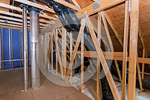Building with wooden beams of a roof installing pipe heating system