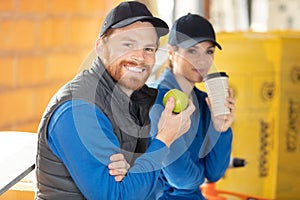 building workers having coffee break