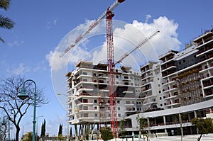 Building yard of Housing construction of houses. The site with cranes