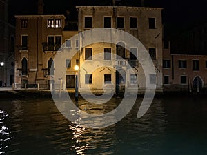 Buildings along the canal in Venice night, Italy