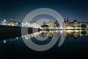 Buildings along Peblinge SÃ¸ at night, in Copenhagen, Denmark.