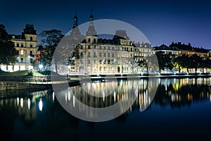 Buildings along Peblinge SÃ¸ at night, in Copenhagen, Denmark.