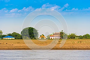 Buildings on the banks of the river Irrawaddy, Mandalay, Myanmar, Burma. Copy space for text.