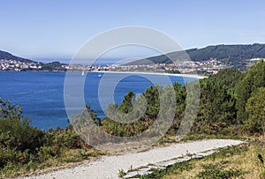 The buildings, the beach and the nature of Fisterra town, the final destination in the Camino de Fisterra, Galicia, in Spain.