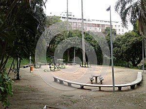 Buildings, benchs and trees in Guinle Park Rio de Janeiro Brazil