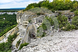 Buildings, buildings and caves of the city of Chufut-Kale, a medieval cave settlement in the Crimea. Cave city.