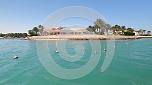 Buildings and canals in El Gouna. View from a floating ship. El Gouna is a tourist resort on the Red Sea coast, part of