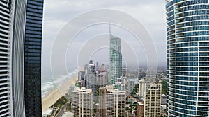 Buildings, coastline and landscape with drone of city for summer, environment and architecture. Sea, water and