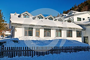 The buildings and fence in winter