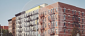 Buildings with fire escapes in Harlem New York, USA