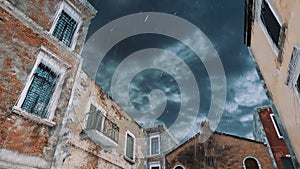 Buildings during flood in Venice against rainy sky 4K