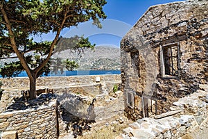 Buildings in the fortress on the island of Spinalonga at the Gulf of Elounda, Crete, Greece. Sea background